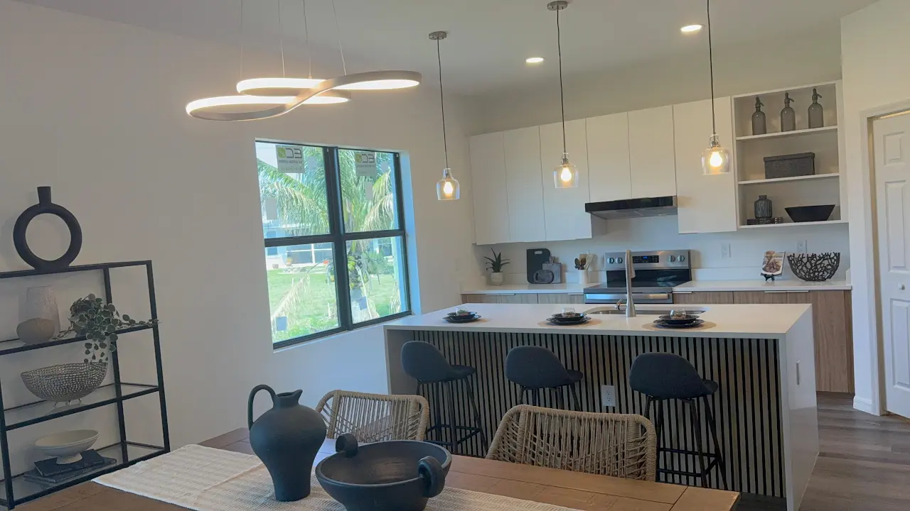 Completed modern kitchen with custom island and pendant lighting